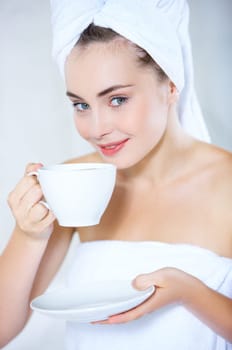 Portrait of cute teenage girl with cup of coffee