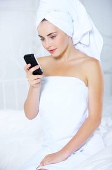 Portrait of cute teenage girl using mobile phone