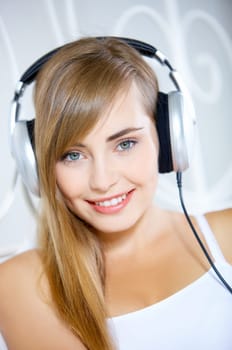 Portrait of cute teenage girl is listening music