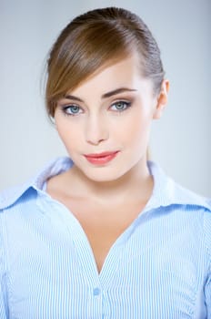 Portrait of beautiful business woman isolated on blue