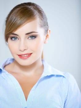 Portrait of beautiful business woman isolated on blue