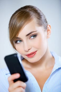 Portrait of beautiful business woman using mobile phone