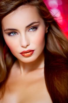 Portrait of beautiful young sexy woman on red background