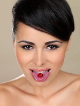 Portrait of beautiful woman, she has pill on her tongue
