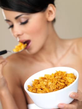Portrait of beautiful woman, she eating cornflakes