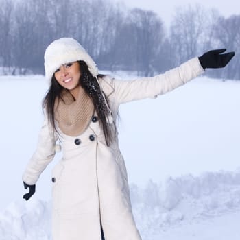 Beautiful and sexy woman in snowy winter outdoors