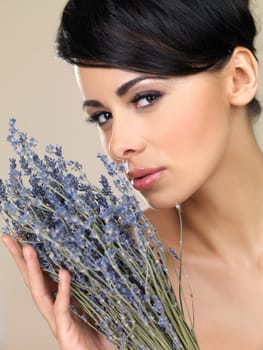 Portrait of beautiful woman, she holding bunch of lavender