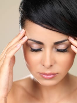 Portrait of beautiful woman, she has migraine