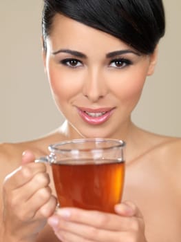 Portrait of beautiful woman, she holding cup of tea