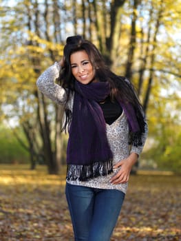 Beautiful woman spending time in park during autumn season