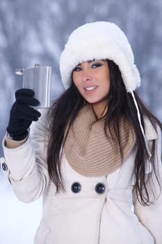 Beautiful and sexy woman in snowy winter outdoors