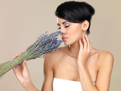 Portrait of beautiful woman, she holding bunch of lavender