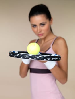 Beautiful female tennis player on natural background