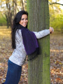 Beautiful woman spending time in park during autumn season