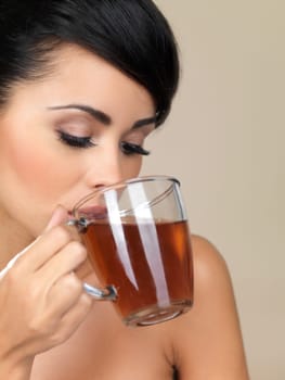 Portrait of beautiful woman, she holding cup of tea