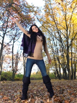 Beautiful woman spending time in park during autumn season