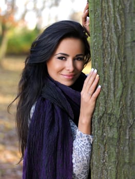 Beautiful woman spending time in park during autumn season