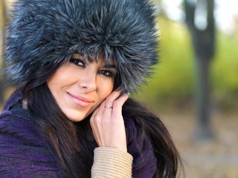 Beautiful woman spending time in park during autumn season