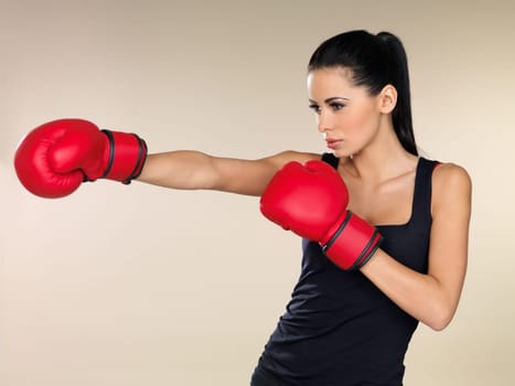 Young beautiful woman during fitness and boxing