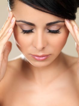 Portrait of beautiful woman, she has headache