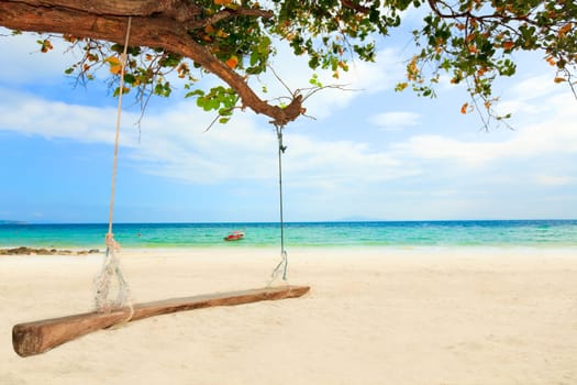 Tropical landscape. Infinity ocean and swing on foreground