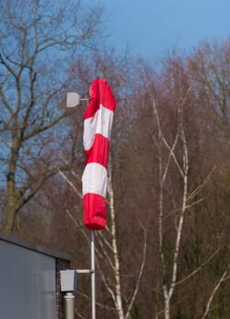 windsock hanging down on a day with no wind