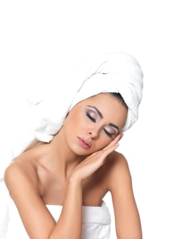 Beautiful and sexy woman wrapped in white towel