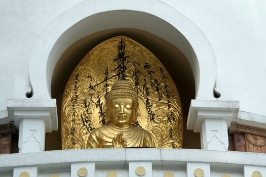 Golden image of Buddha in Buddhist Stupa in Darjeeling, West Bengal, India, Asia
