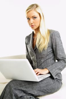Portrait of a businesswoman when working on laptop computer