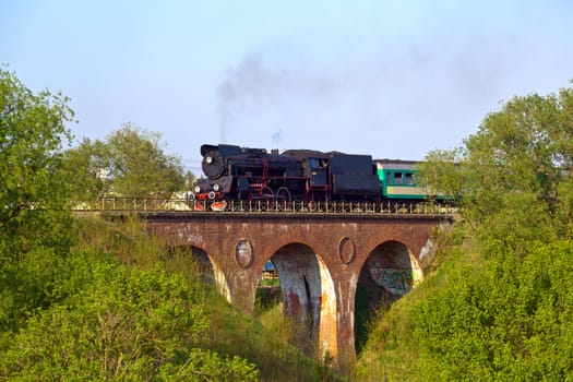 Vintage steam passing over the viaduct