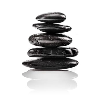 A Staple Massage or Zen Stones isolated on white for wellness concepts.