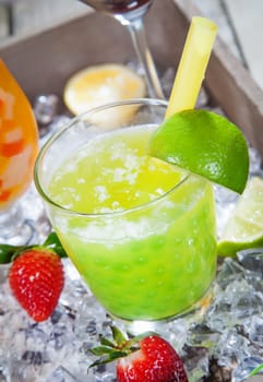Fresh Lime pearl tea Cocktail standing on a bed of crushed ice