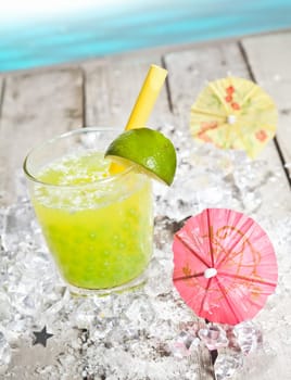 Citrus flavored Pearl Tea refreshment on a deck in front of the pacific ocean