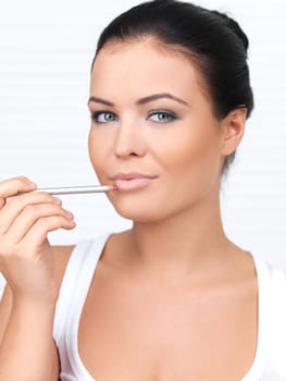 Portrait of beautiful woman, she doing makeup