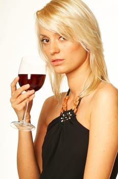 Pretty young blonde women with glass of red wine