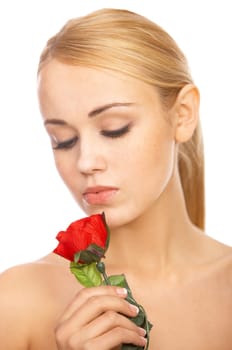 Portrait of cute blond woman, holding red rose