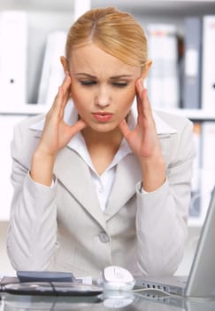 Beautiful business woman wit headache in office
