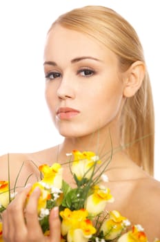 Portrait of cute blond woman, holding bunch of roses