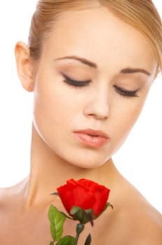 Portrait of cute blond woman, holding red rose