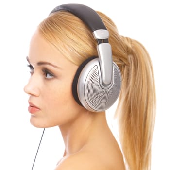 Portrait of cute blond woman, she is listen music