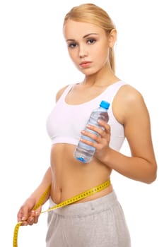 Portfait of Sporty beautiful girl holding bottle of water