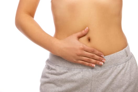 Stomach and hand of Sporty beautiful girl standing on white