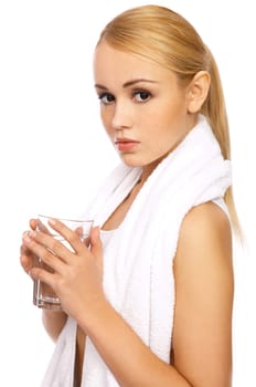 Portfait of Sporty beautiful girl holding glass of water