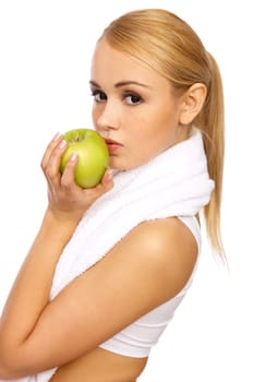 Portfait of Sporty beautiful girl holding apple