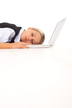 Very tired Businesswoman sleeping on her laptop while lying down on the floor