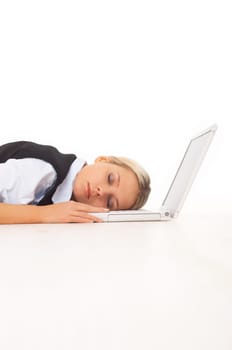 Very tired Businesswoman sleeping on her laptop while lying down on the floor