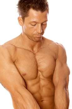 Muscular and tanned male isolated on white