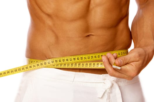 Muscular and tanned male body parts is being measured
