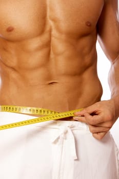 Muscular and tanned male body parts is being measured