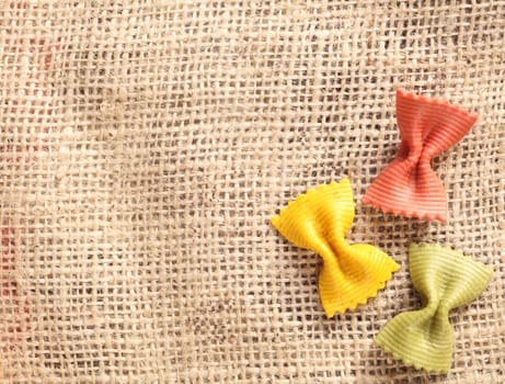 three noodles butterfly shaped on a fabric background